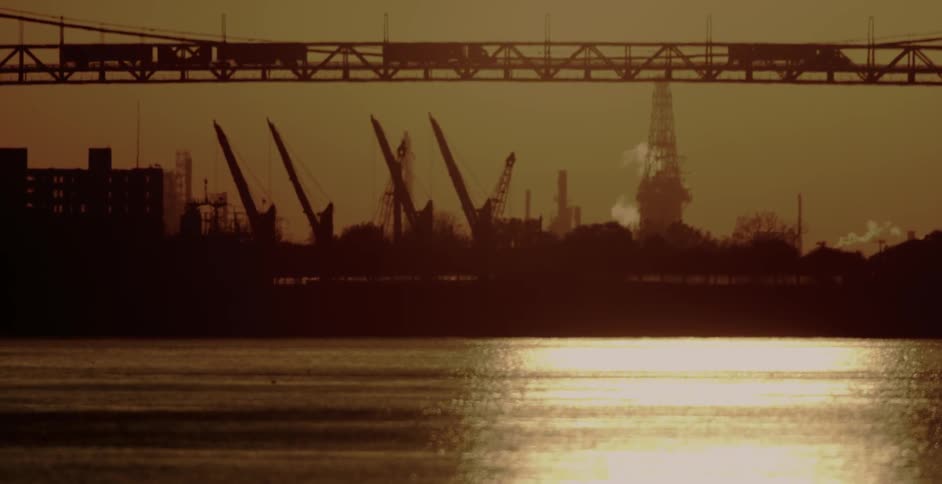 A construction site behind a lake
