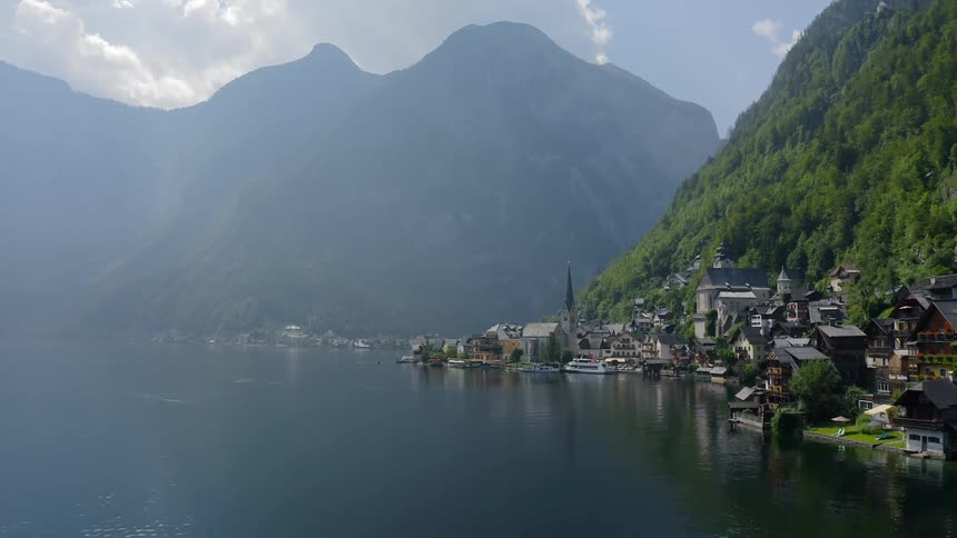 Large estates line the very edge of a mountainside coast line