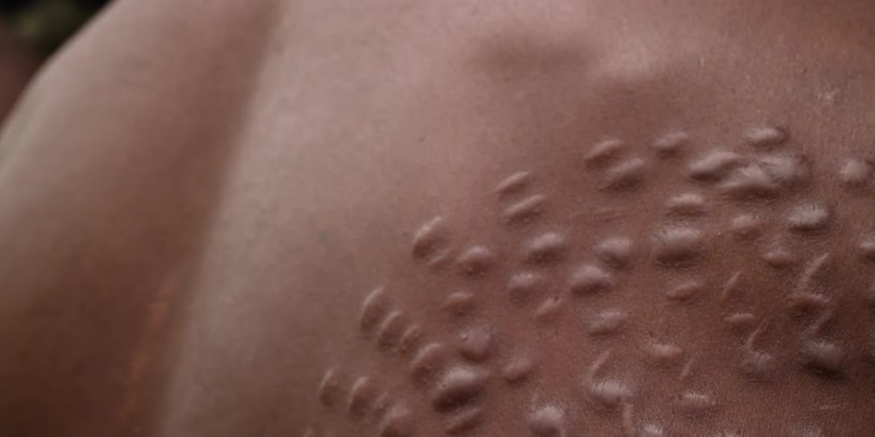 Men with a tribal scarring