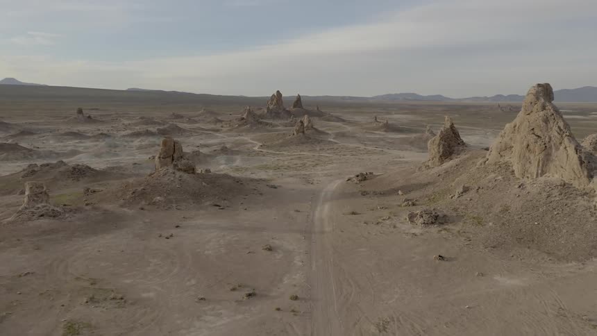 Road winds through desert among rocky outcroppings