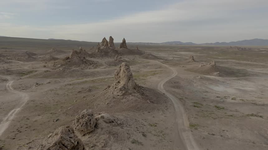 Roads weave between rock outcroppings in desert