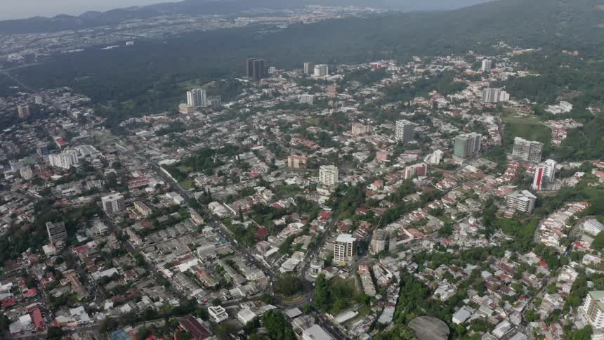 A large city sprawls across the landscape