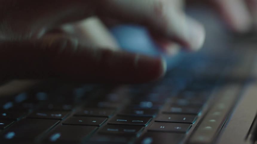 Someone typing on a keyboard