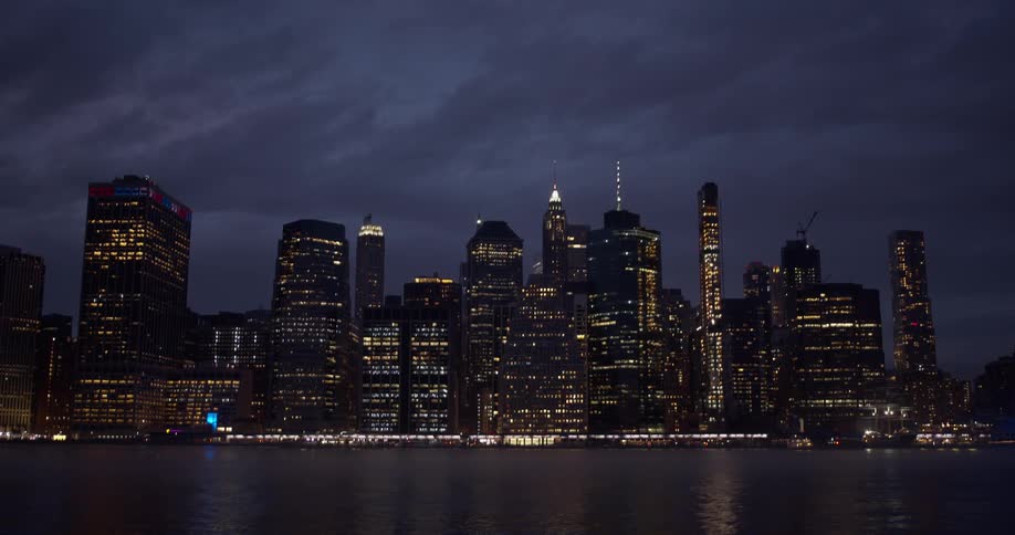 Downtown city lights reflect off water