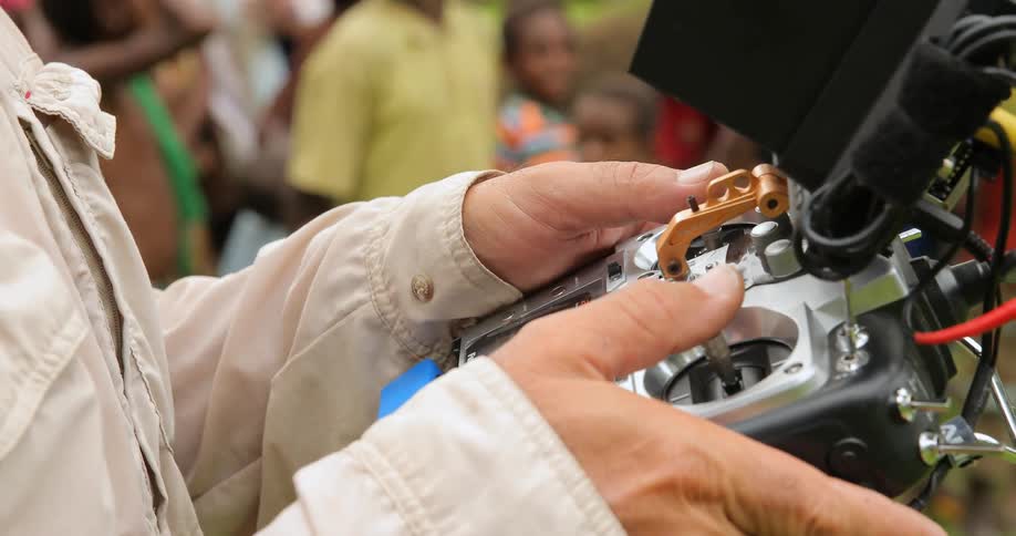 A man holds an elaborate remote control