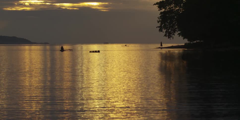 A body of water at sunset