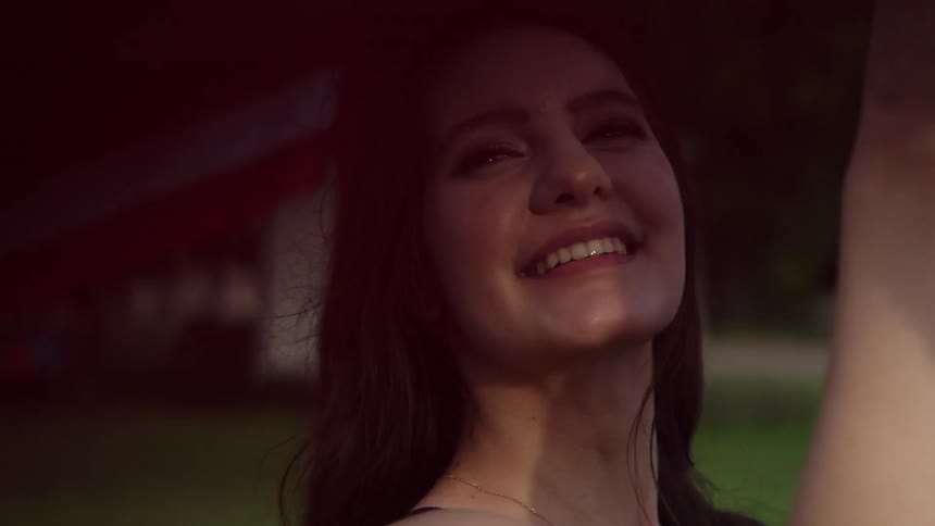 Girl smiling while holding american flag