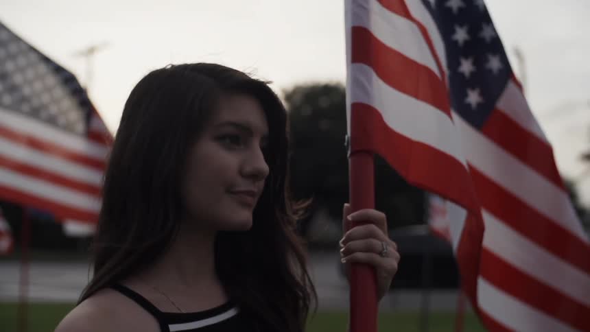 Girl holding american flag