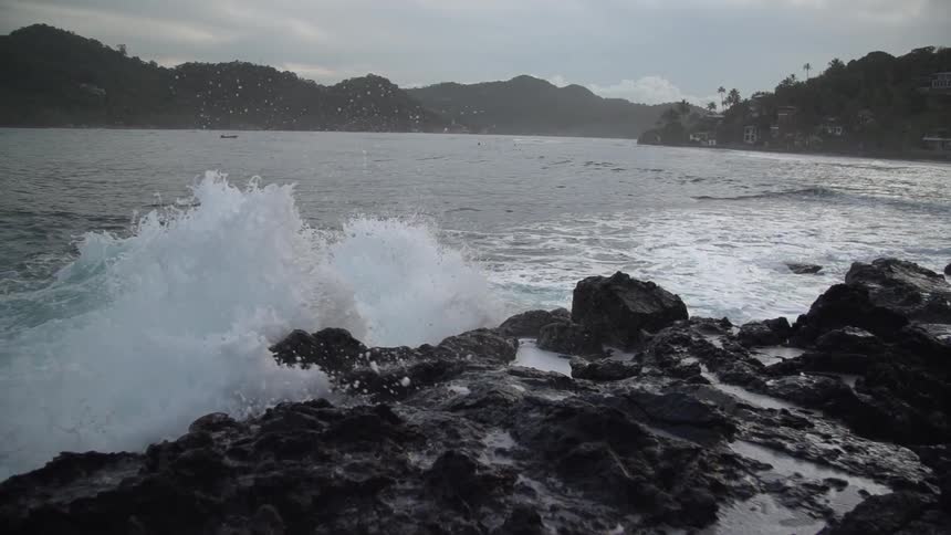 Wavers crashing on rocks