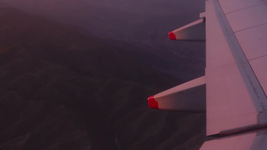 View of an airplane wing as it flies