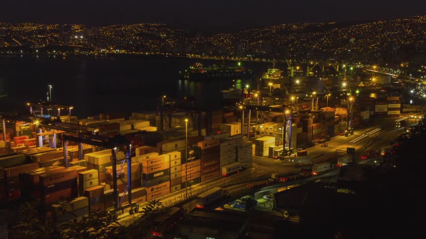Time lapse of boats and freight at a harbor