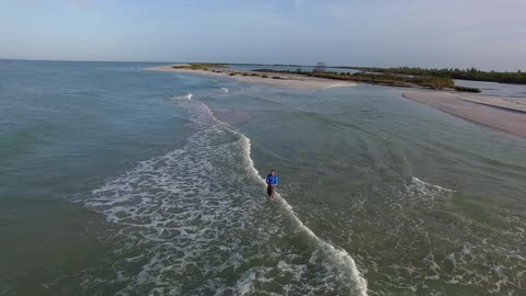 Man stands in ocean waves