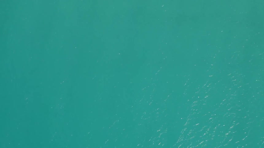 Gentle ripples across tropical aquamarine colored water