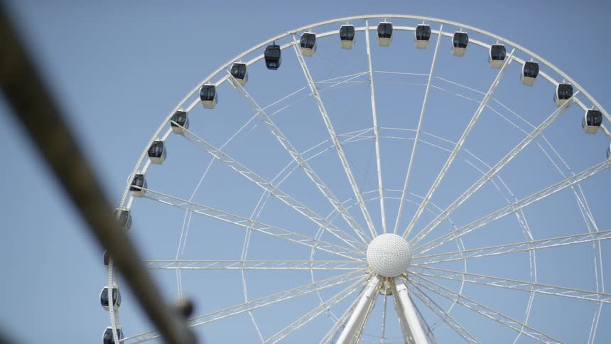 A scenery of a ferris wheel at the theme park