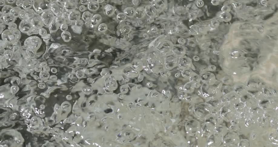 Water bubbles over rocks