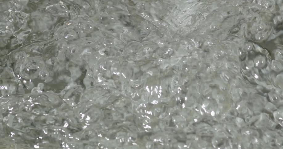 Waves of bubbling clear water