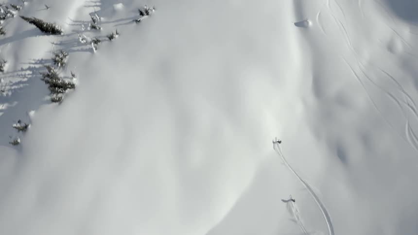 A bird eye view of people skiing at the snowy mountain