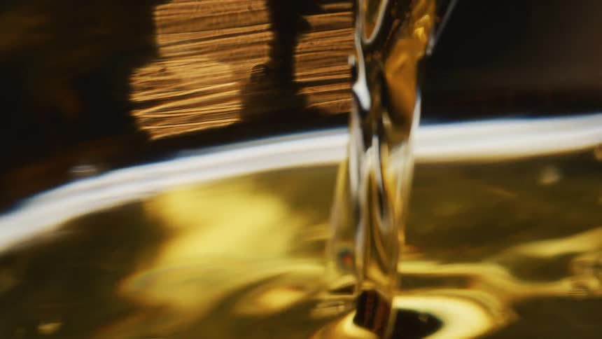 A liquid pouring into a glass