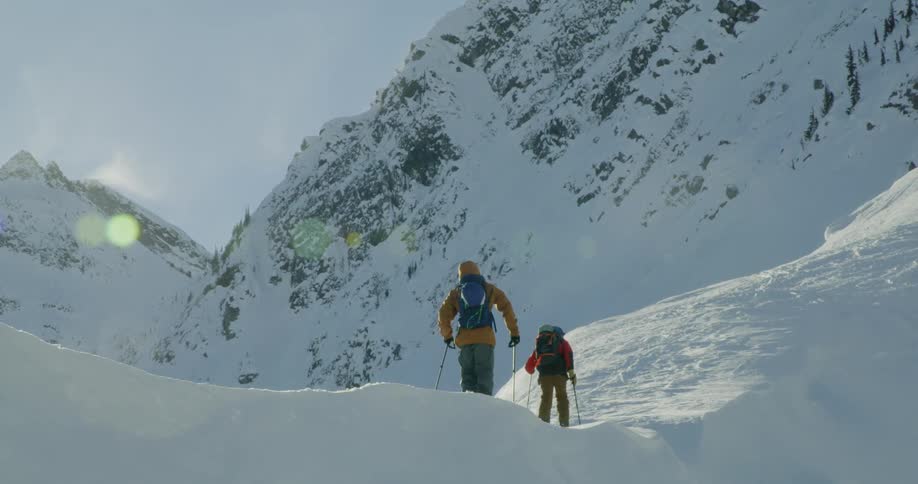 People hiking on the snow mountain