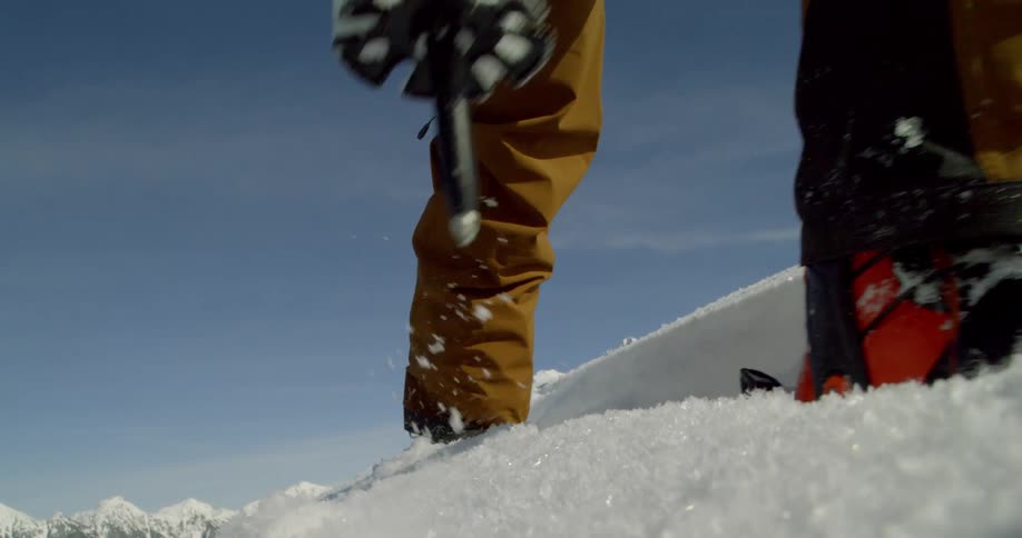 Man cross country skis over the snow