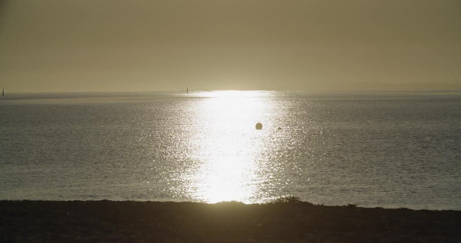 A scenery of an ocean at the dawn