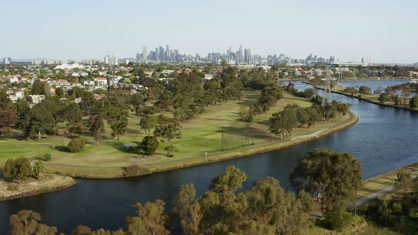 A waterway runs next to a golf course