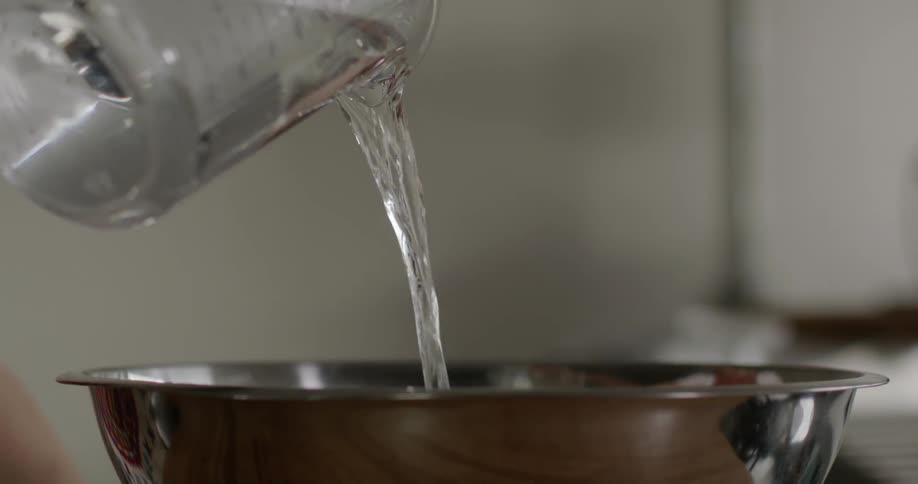 A footage of water being poured into a bowl