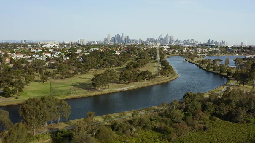 A scenery of a river in the middle of city park