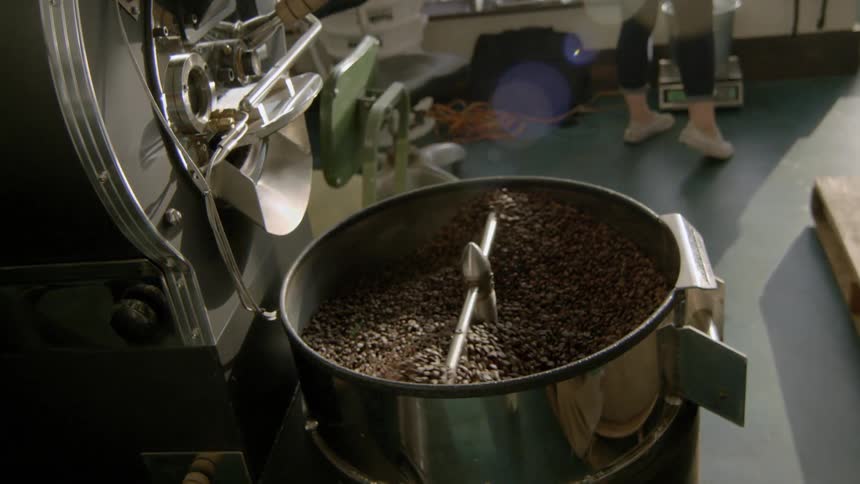 Coffee beans being roasted in warehouse