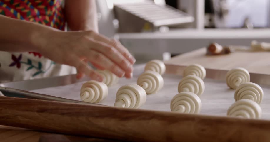 A woman is preparing food on a tray