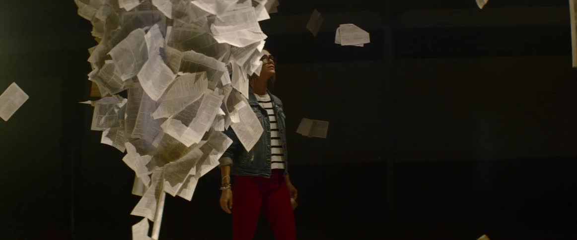 A woman enjoying art installation at the gallery