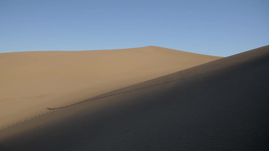 A desert area covered in sand is displayed