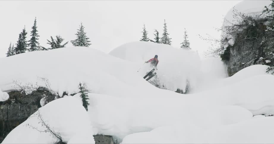 A skier jumps from a small hill
