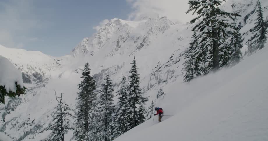 A man doing a skiing at the snowy mountain on winter