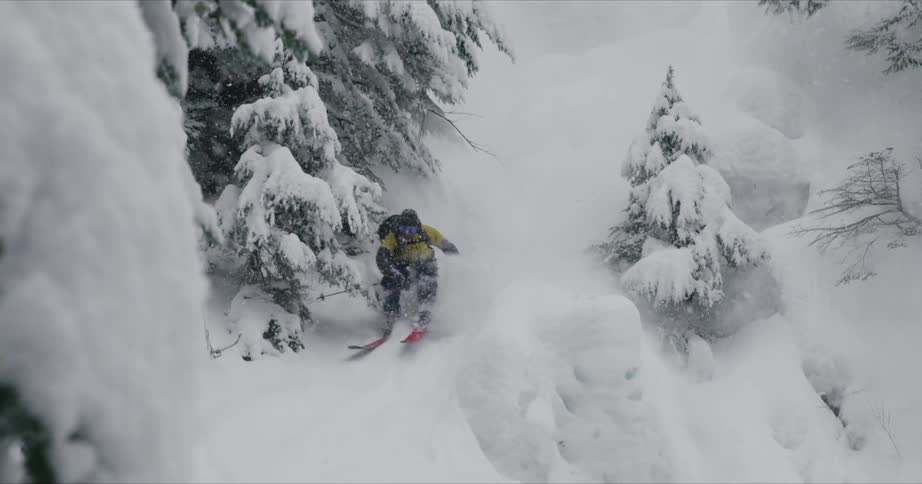 A man skiing on the snowy mountain