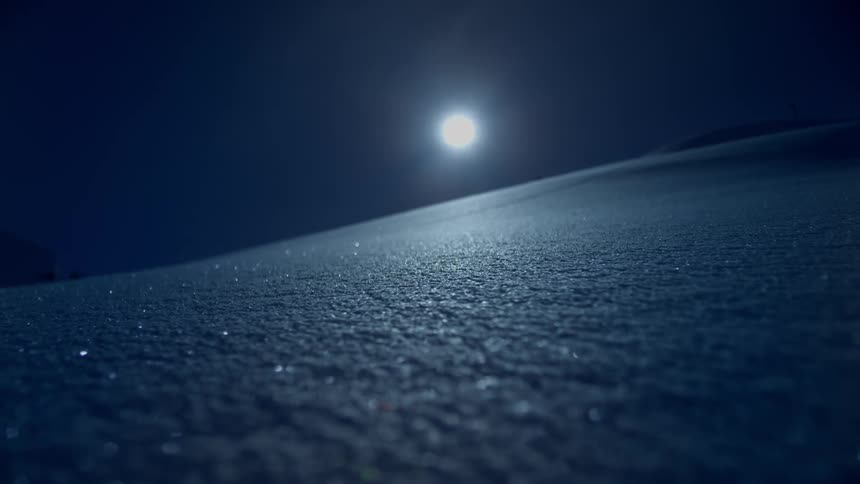 A beautiful scenery of moon from the icy mountain peak