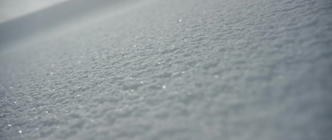 Sun glints of snow on cloudy day
