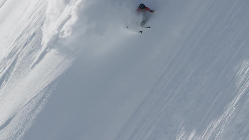 A man skiing at the slopy mountain