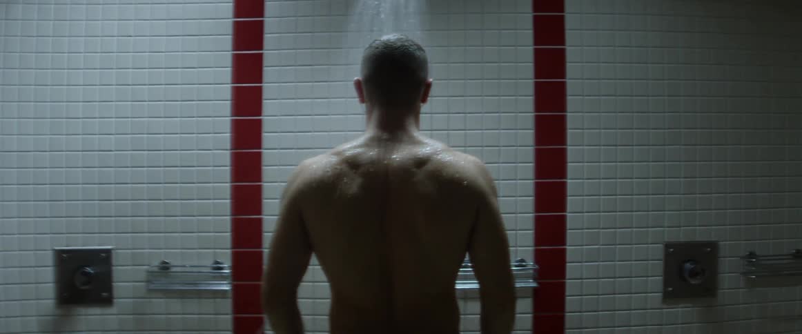A man showering on the bathroom