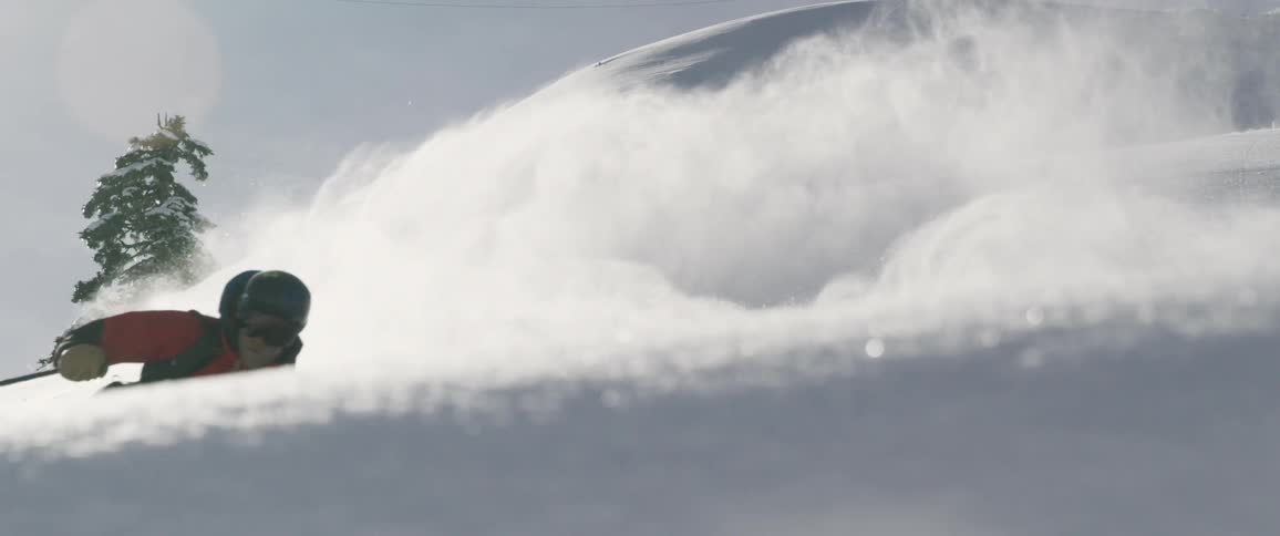 A person skis down a slope