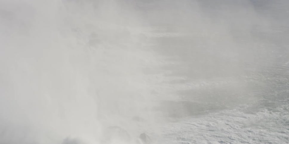 Mist floats over the snowy land