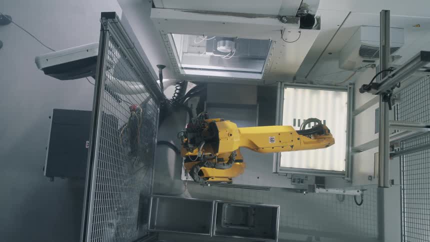 A footage of yellow robotic hands in action