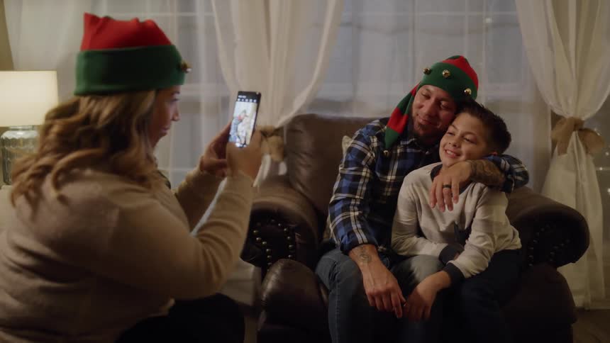 A family taking a picture on the christmas day