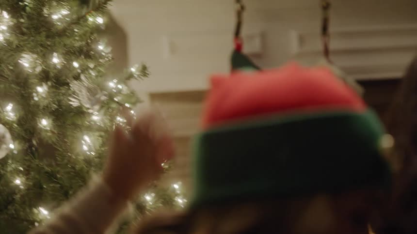 Father and daughter decorating the christmas tree