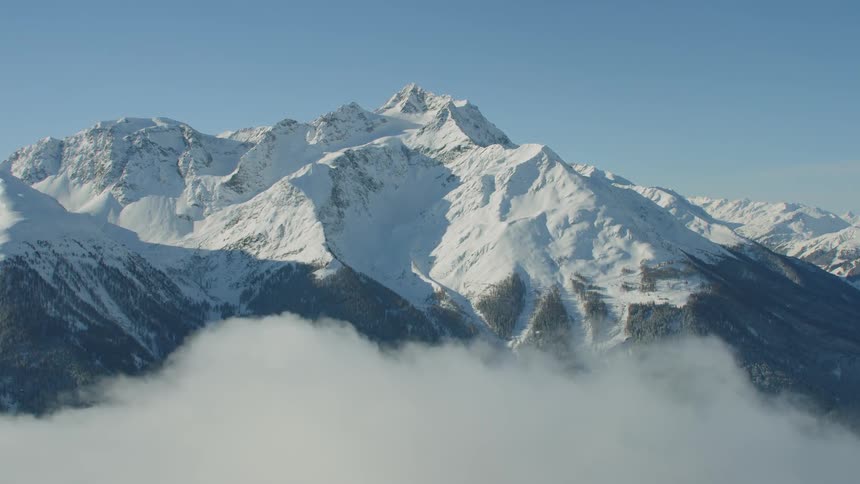 Clouds form around the mountains