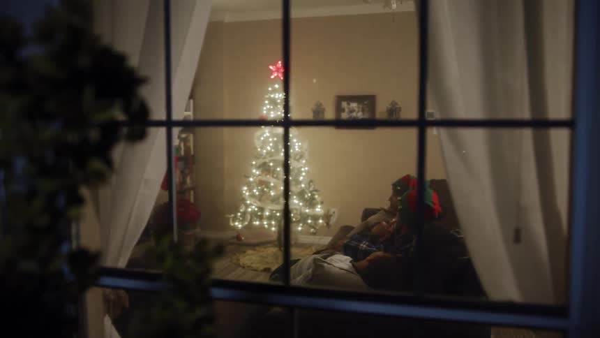A family sits on the couch
