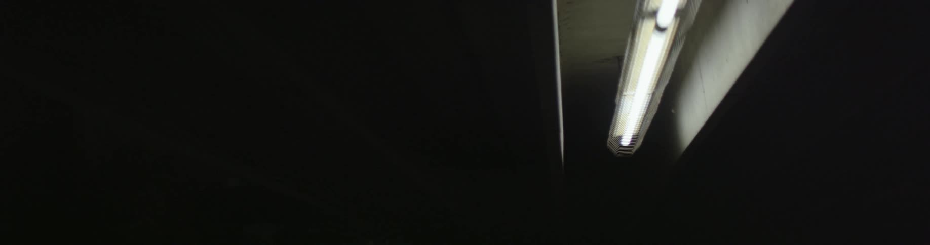 A fluorescent light in a dark room