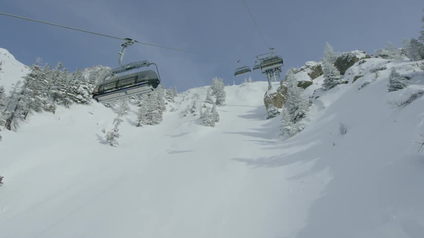 The ski lifts transport people up the slope