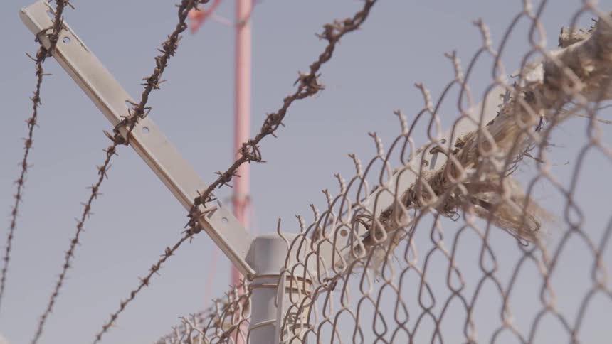 A scenery of a barbed wire fence