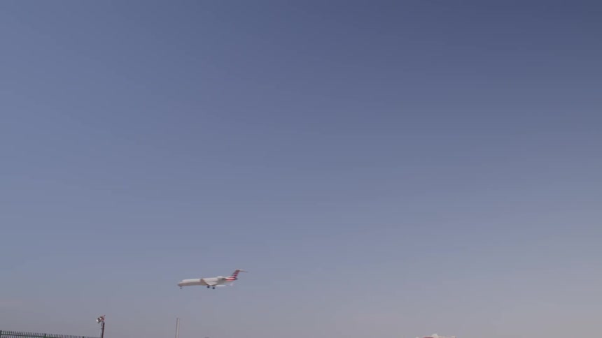 An airplane is flying in the sky